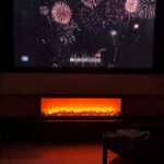 A warm Art Deco style fireplace light